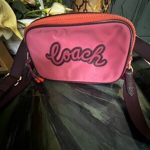 Coach Pink Crossbody Bag with Bold Script Design